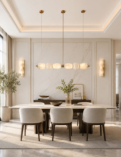 Matching alabaster stone pendant light and wall light creating a warm, inviting atmosphere in a modern dining room.