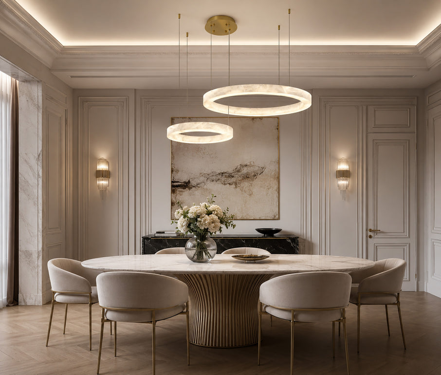 Modern alabaster stone ring pendant light hanging above a dining table.
