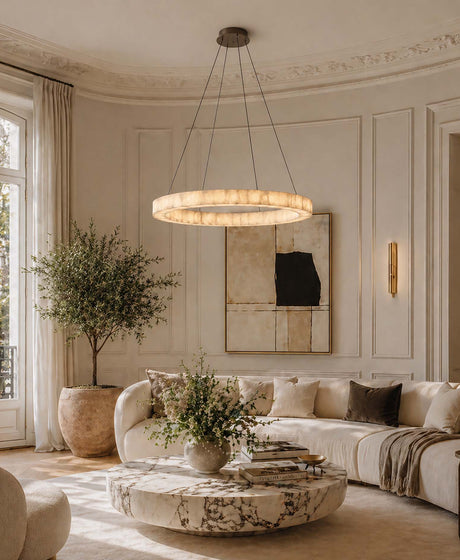 A circular pendant light hangs in the modern European-style living room. Crafted from Spanish marble and measuring 1.2 metres in diameter, it hangs elegantly above a 1.5-metre circular coffee table, creating a sophisticated yet cosy atmosphere in the living room.