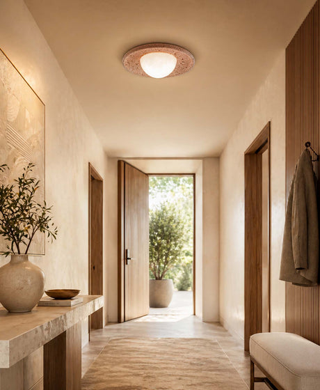 Ceiling lights for a hallway, featuring a warm stone flush-mounted light in a modern Japandi-style entrance hall with wooden accents and soft, natural tones.